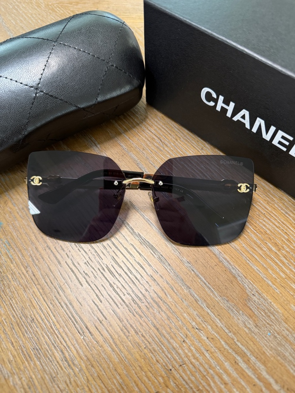 Chanel Women's Black and Gold Rimless Square Sunglasses - Picture 2 of 9
